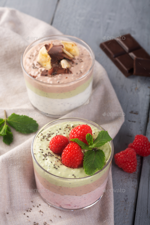 Chia seed pudding with three flavors, cocoa, matcha and strawberry with yoghurt, chocolate and mint - Stock Photo - Images