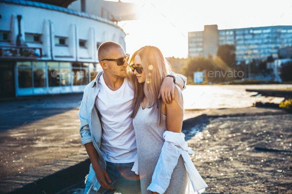 Tanned young caucasian couple, modern lovestory in film grain effect - Stock Photo - Images