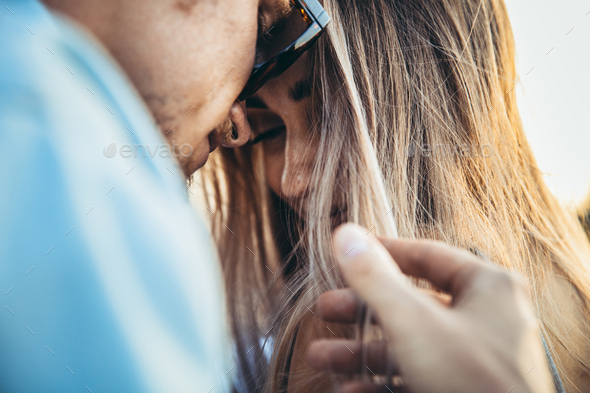 Tanned young caucasian couple, modern lovestory in film grain effect - Stock Photo - Images