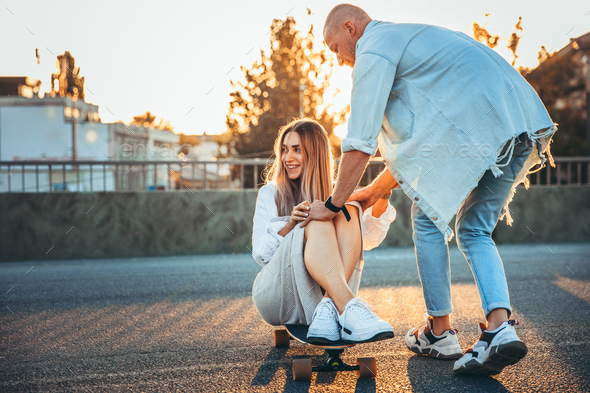 Tanned young caucasian couple, modern lovestory in film grain effect - Stock Photo - Images