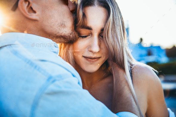 Tanned young caucasian couple, modern lovestory in film grain effect - Stock Photo - Images