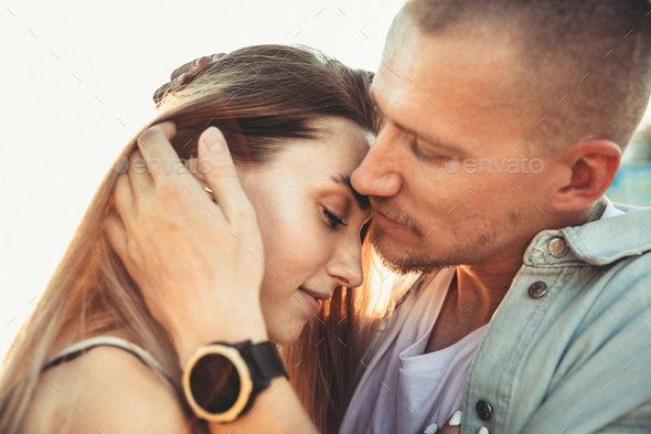 Tanned young caucasian couple, modern lovestory in film grain effect - Stock Photo - Images