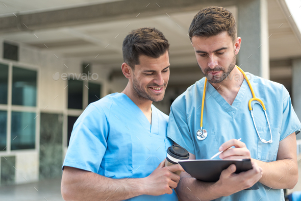 male nurse with stethoscope and coffee