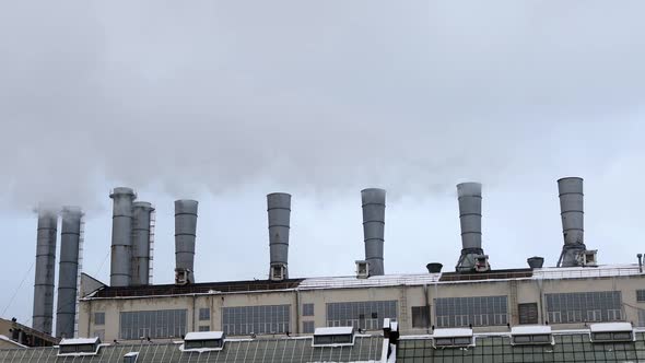 Smoke Billows From the Pipes of a Hydroelectric Power Station