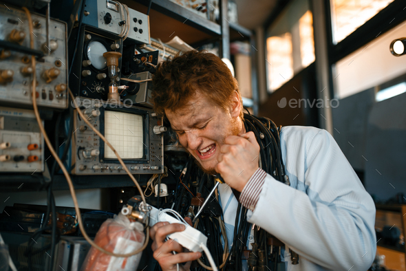 Crazy scientist works with electricity in lab