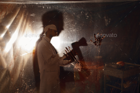 Psychiatrist maniac with axe, bloody experiment - Stock Photo - Images