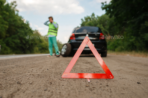 Emergency stop sign, car breakdown, flat tyre - Stock Photo - Images