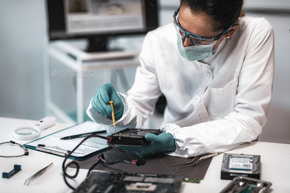 Forensic Science Technician Analyzing Evidence in Laboratory