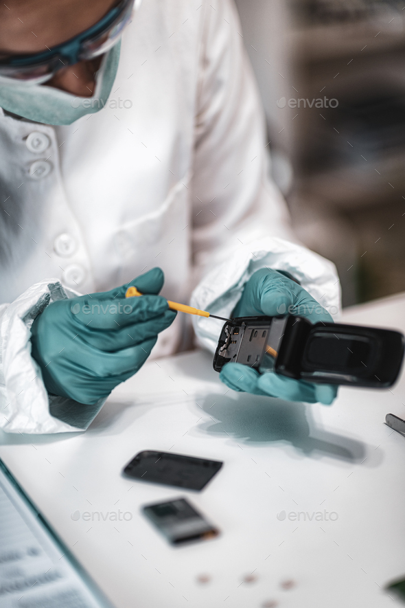 Forensics. Police Expert Examining Confiscated Mobile phone