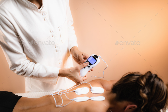 Lower Back Physical Therapy with TENS Electrode Pads, Transcutaneous  Electrical Nerve Stimulation Stock Photo