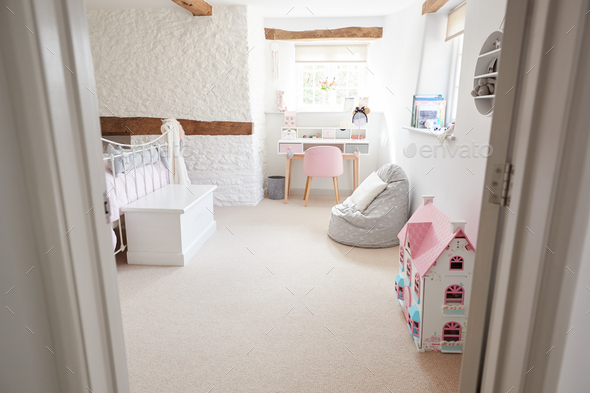 Empty Interior Of Young Girls Bedroom With Desk And Storage