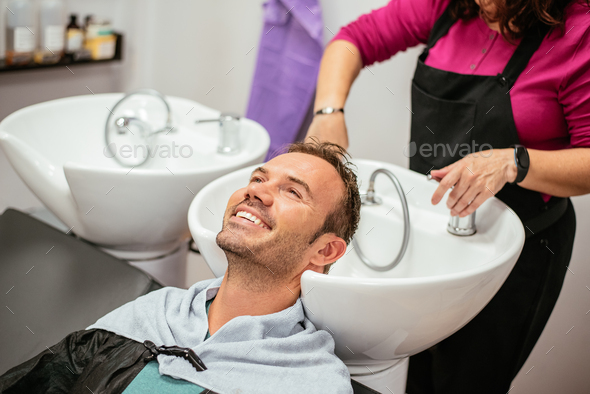 Man Having His Hair Washed In A Barbershop Stock Photo By Davidpradoperucha