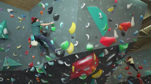 Сlimber Training on a Climbing Wall Practicing Rockclimbing Moving Up Mountaineer Training Physical alt
