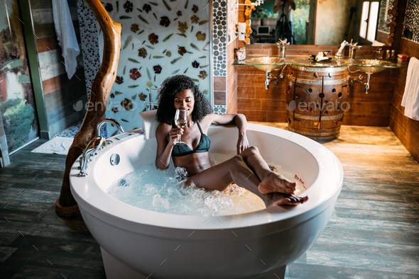 Young woman relaxing in the hydro massage bath