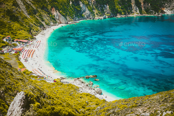 Myrtos beach with azure blue sea water in the bay. Favorite tourist visiting destination place at - Stock Photo - Images