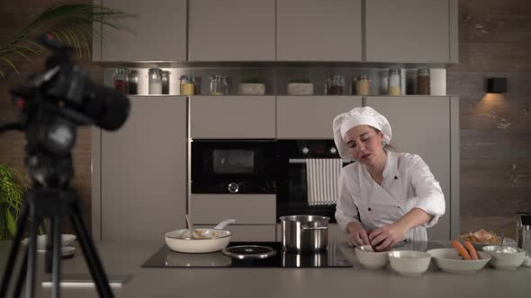 Female Chef Foodblogger Working in Kitchen alt