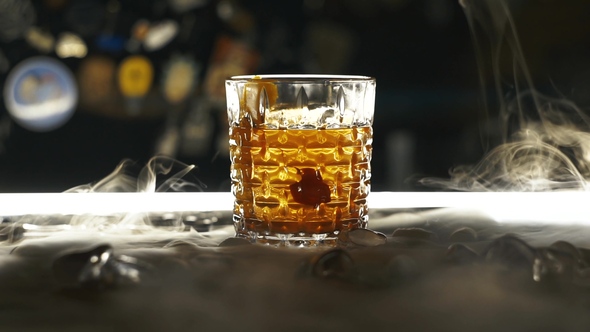 Cocktail with Dry Ice on the Bar alt