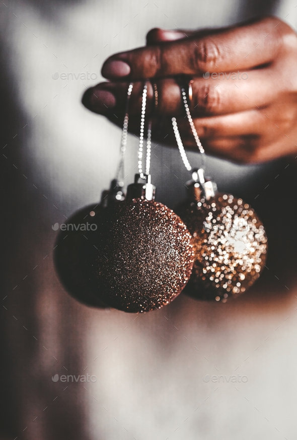 Woman in warm sweater holding toys glass decorative balls in hands, copy space. Christmas - Stock Photo - Images