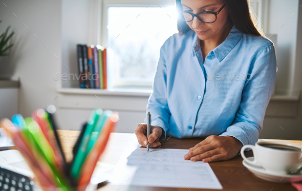Young businesswoman busy writing notes - Stock Photo - Images