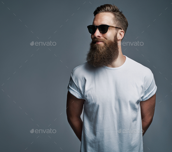 Bearded Handsome Man With Sunglasses Looking Over Stock Photo By Flamingoimages