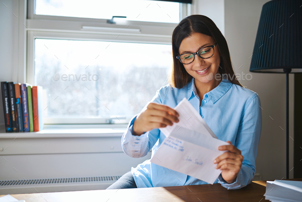 Young business entrepreneur checking her mail