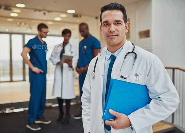 Thoughtful young Hispanic doctor in a hospital - Stock Photo - Images