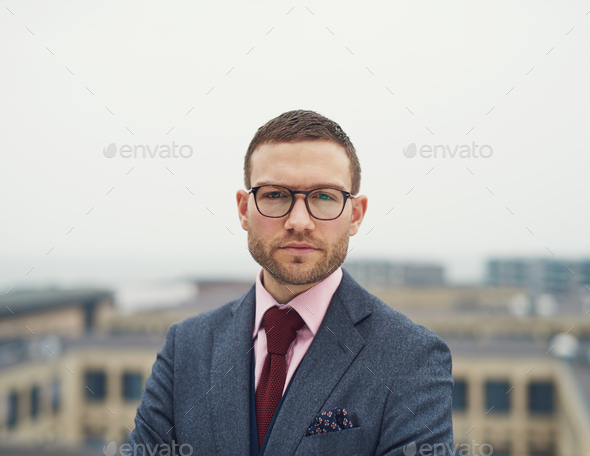 Determined intense young businessman - Stock Photo - Images
