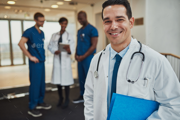 Successful handsome doctor with a beaming smile - Stock Photo - Images