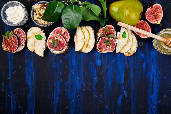 Bruschetta and Crostini with pear, ricotta cheese, honey, figs. - Stock Photo - Images
