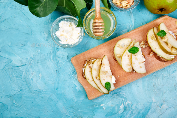 Bruschetta and Crostini with pear, ricotta cheese, honey. - Stock Photo - Images