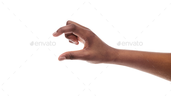 African american female hand measuring invisible items on white background - Stock Photo - Images