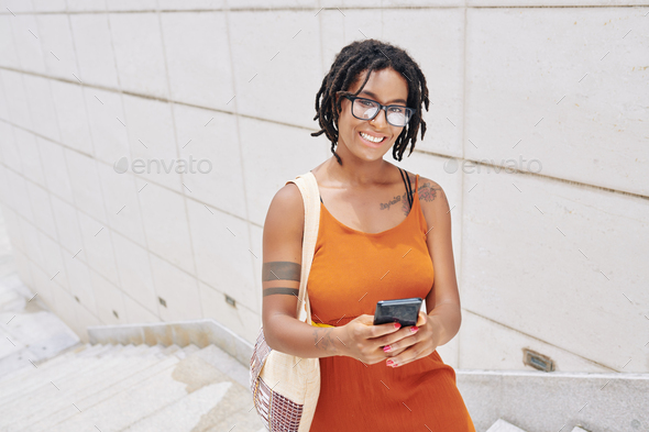 African woman with mobile phone - Stock Photo - Images