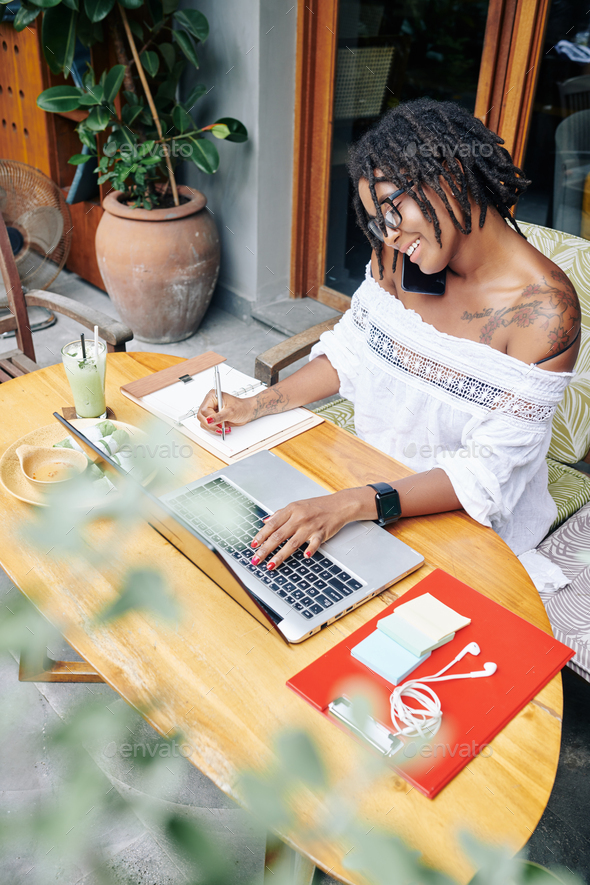 Businesswoman working on laptop - Stock Photo - Images