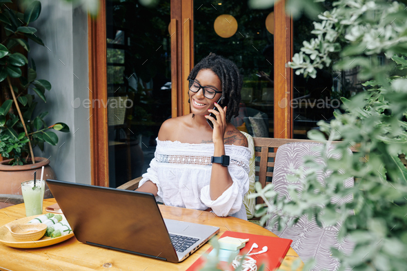 Businesswoman working at cafe - Stock Photo - Images