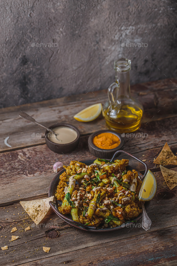 Deep Fried Cauliflower with tahina, middle eastern dinner, copy space