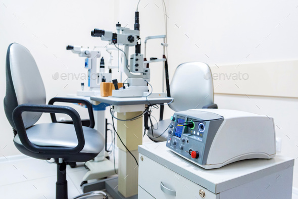 Close up modern ophthalmological laser used for eye surgery on table - Stock Photo - Images