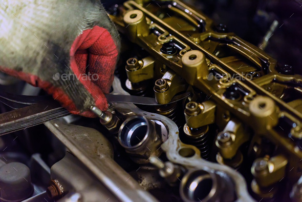 Maintenance check and adjust valve lash in car engine Stock Photo by ...