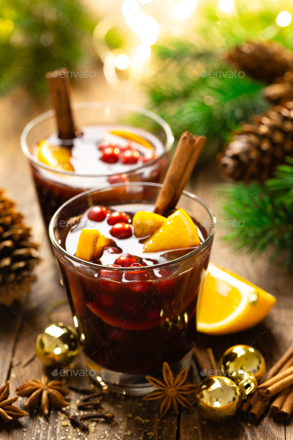 Christmas mulled red wine with spices and oranges - Stock Photo - Images