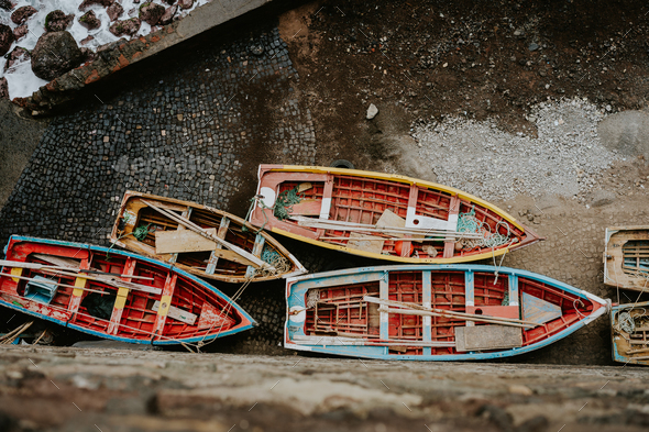 Local traditional fishing boats under shalter during storm in atlantic ocean. View from above, view - Stock Photo - Images