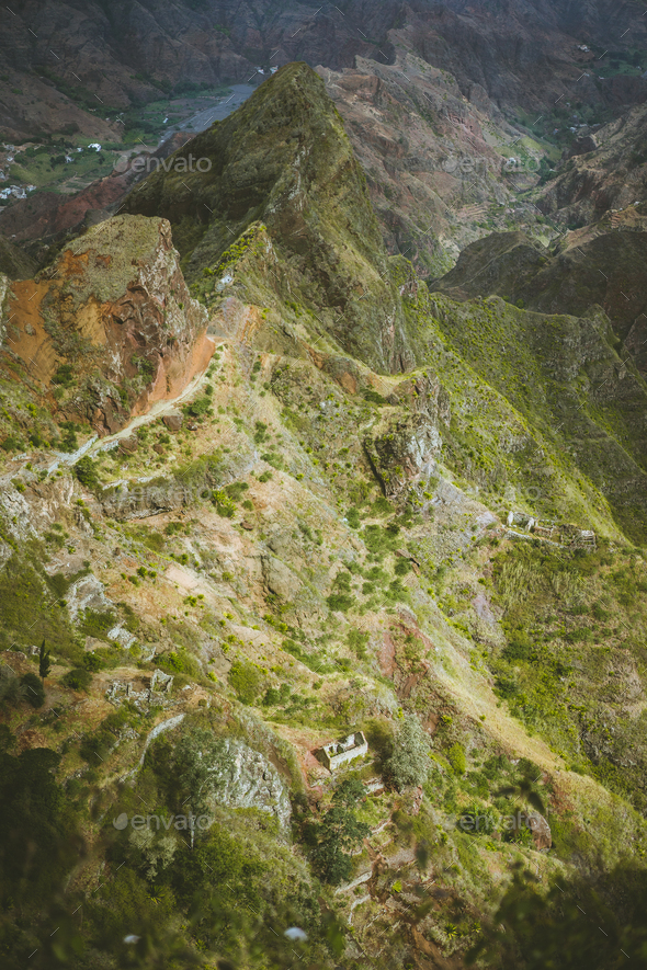 Spectacular view above sharp mountain ridge. Green valleys stretch down both sides of the ridge - Stock Photo - Images