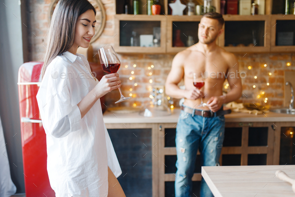 Love couple spend romantic dinner on the kitchen - Stock Photo - Images