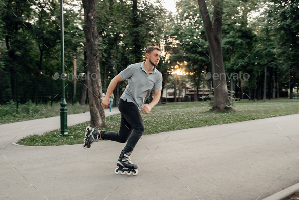 Roller skating, male skater rolling in action - Stock Photo - Images