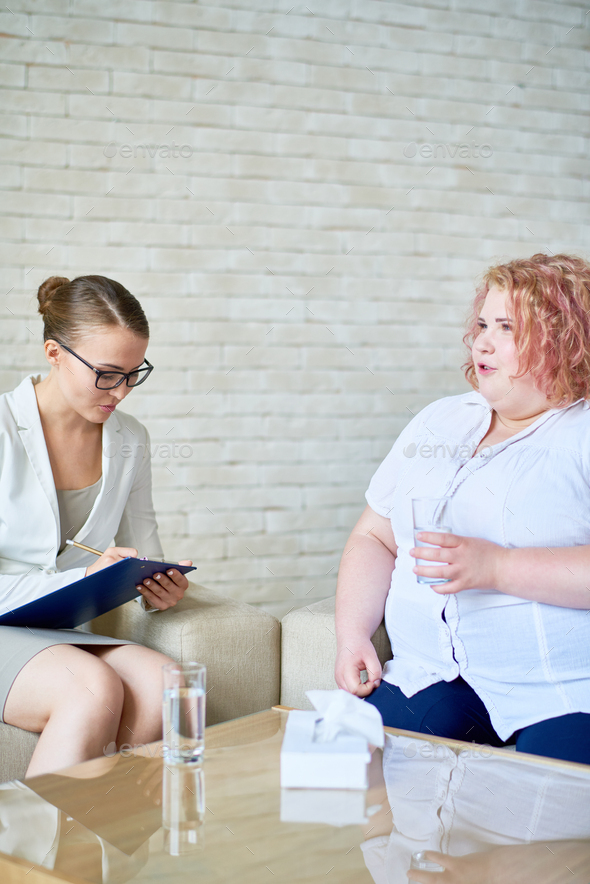 Overweight Young Woman Consulting Psychologist - Stock Photo - Images