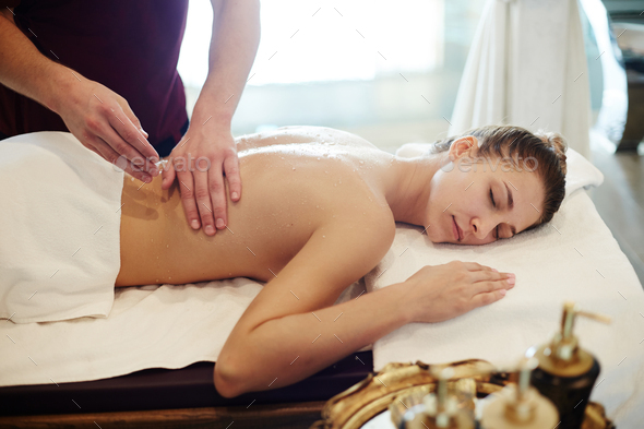 Young Woman Enjoying Massage in SPA - Stock Photo - Images