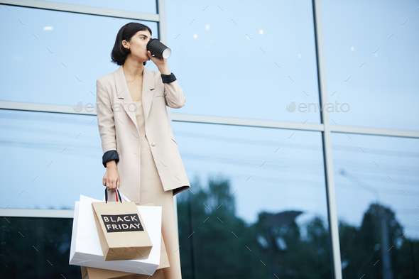 Elegant Woman Holding Shopping Bags - Stock Photo - Images