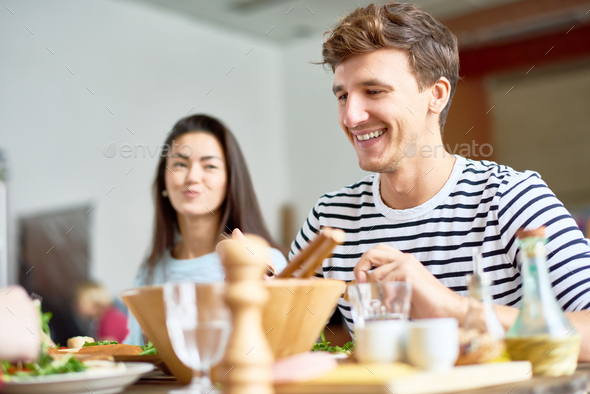 Happy Young Man at Dinner Table - Stock Photo - Images