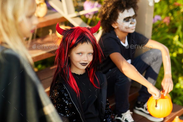 Little Girl with Friends on Halloween - Stock Photo - Images