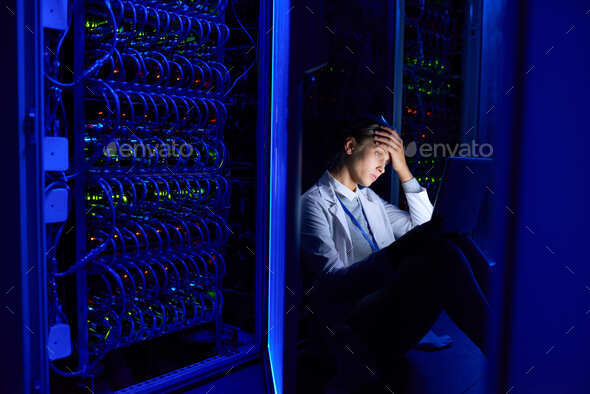 Network Engineer Working at Night