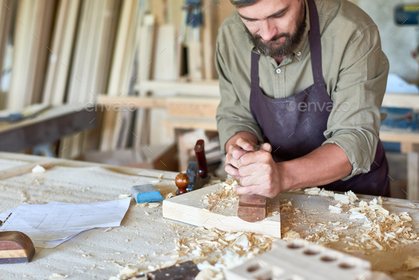 Carpenter Working in Traditional Woodworking Shop