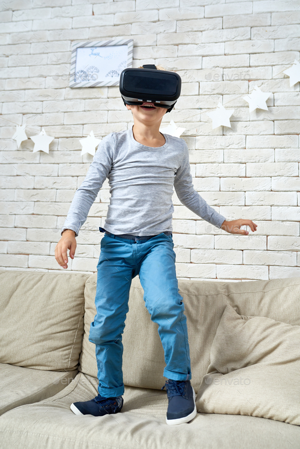 Happy Little Boy Wearing VR Glasses